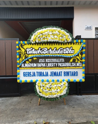 Papan Bunga Duka di Poka